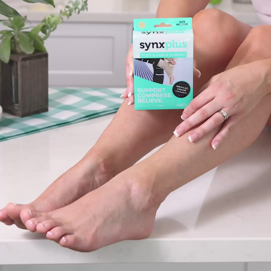 lady demonstrating on how to wear a synxplus foot and ankle compression sleeve to assist relieve pain, swelling, inflammation